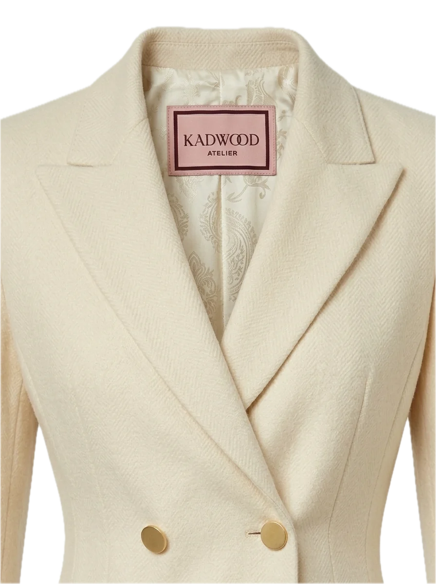 Detail of an ivory Kadwood suit jacket and its patterned silk lining.